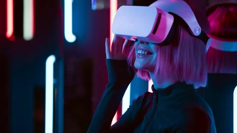 Female in VR glasses interacting with network while having virtual reality. Stock Footage 261960375