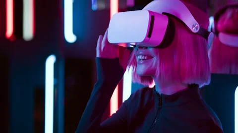Female in VR glasses interacting with network while having virtual reality. Stock Footage 261960562