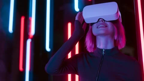 Female in VR glasses interacting with network while having virtual reality. Stock Footage 261960889