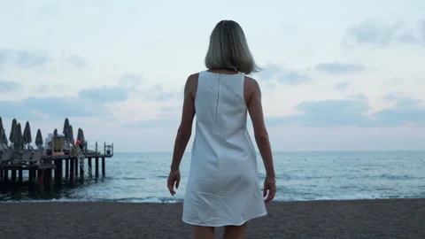 Female walking on the beach. Stock Footage 278116868