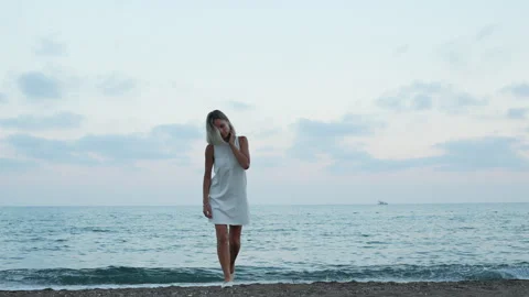 Female walking on the beach. Stock Footage 278117012
