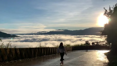 Female walking in the clouds of Benguet Stock Footage 133640241