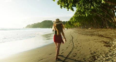 Female Walking Down The Beach Gracefully 4K Slow motion Cinimatic Video Stock Footage 124105114