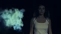 The female walking in a night park against a man silhouette. slow motion 4k or 4k+ Resolution