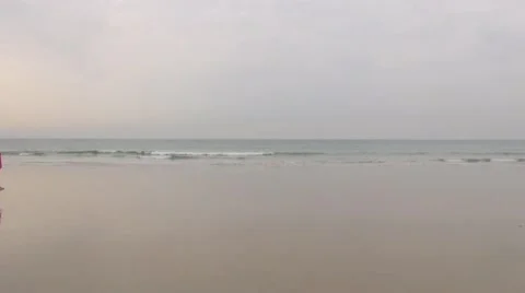 Female walking on seashore Stock Footage 17480915