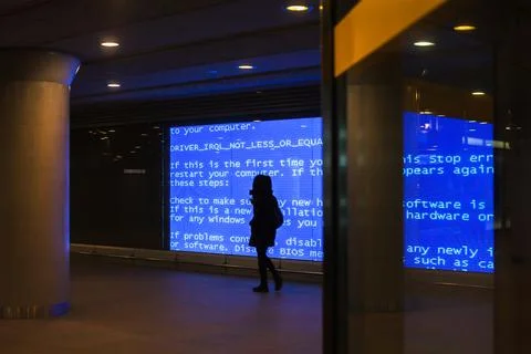Female walking in a tunnel with binary code walls Stockfoto's