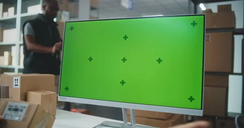 Female Warehouse Associate Scans Code, Enters Information on Computer with Stock Footage 307665983