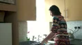 Female washing up and chatting HD Footage