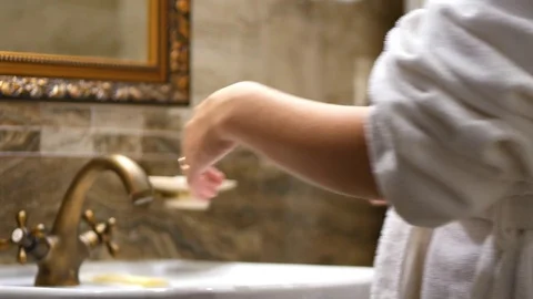 Female Washing and Drying Her Hands at Sink Faucet - 4k. Stock Footage