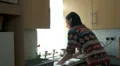 Female washing up in a hurry HD Footage