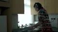 Female washing up to music HD Footage