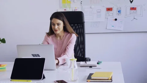 Female web designer working at creative agency office Stock Footage 102848692