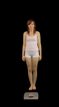 Female on weight scale Stock Footage 8948362