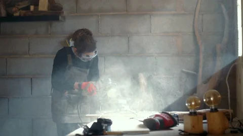 Female woodworker using grinder in carpentry Video stock 167421970