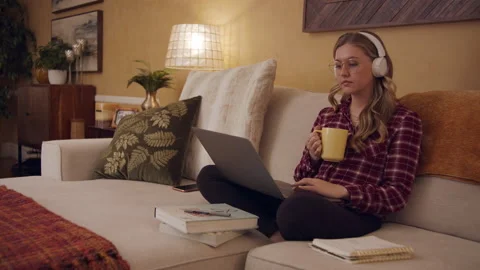 Female Work From Home Study Remote on Couch Living Room 24fps 01 Stock Footage 188042156
