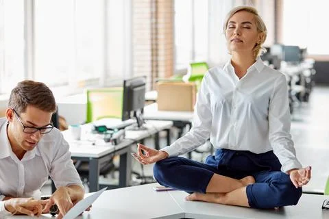 Female at work keep calm, keep balance of mental health Stock Photos