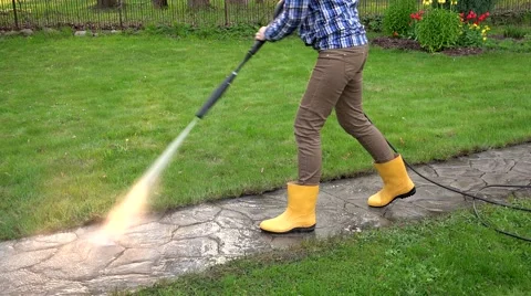 Female worker clean dirty path with special tool Stock Footage 64307350