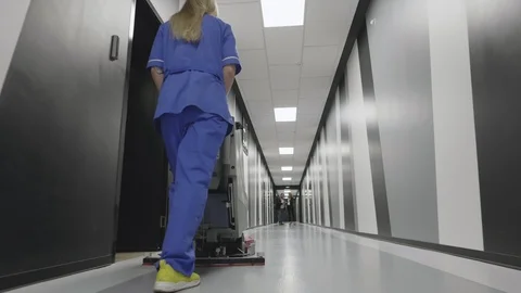 Female worker cleaning floor with machine. Stock Footage 107588879