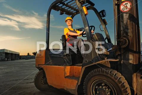 Female worker driving cargo truck Stock Photos