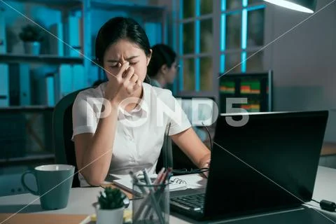 Female worker eyes are dry and hurt painful Stock Photos