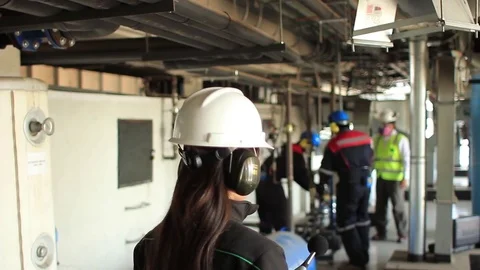 Female worker in industrial setting Stock Footage 77044691