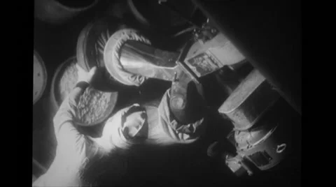 Female worker moving container filled with pellets in manufacturing plant Stock Footage 37593903