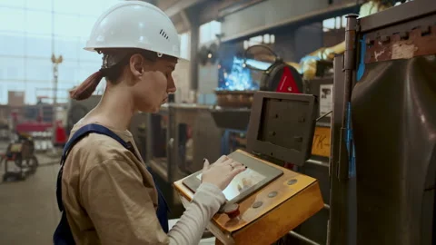 Female Worker Operating Welding Machine in Industrial Plant Stock Footage 296263365