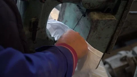 A female worker packs sugar using machine on the conveyor belt of sugar beet pla Stock Footage 166366909