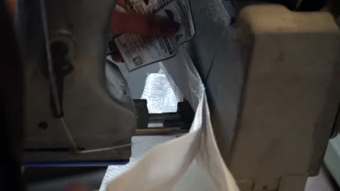 A female worker packs sugar using machine on the conveyor belt of sugar beet pla Stock Footage 166366931