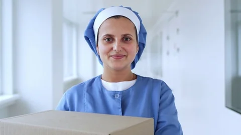 Female worker portrait smiling. Worker woman looking at camera Stock Footage 78407348