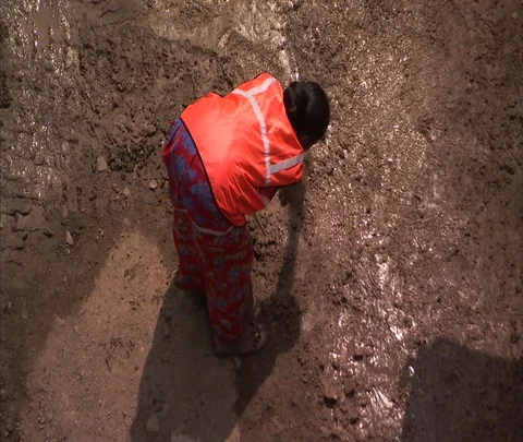 Female worker smoothing concrete at construction site Stock Footage 86741496