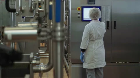 Female Worker is touching the Control Pa... | Stock Video | Pond5
