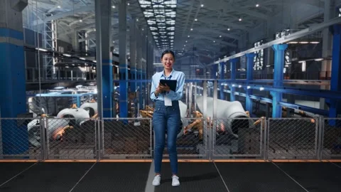 Female Worker Use A Tablet And Smiling To Camera In The Wind Turbine Factory Stock Footage 270225583