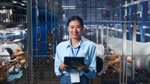 Female Worker Use Tablet And Smiling To Camera In The Wind Turbine Factory Stock Footage 270225936