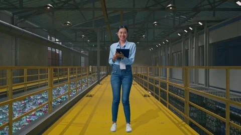 Female Worker Use A Tablet And Smiling To Camera, Plastic Recycling Factory Stock Footage 315157015