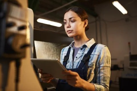 Female worker using tablet pc in the plant 写真素材