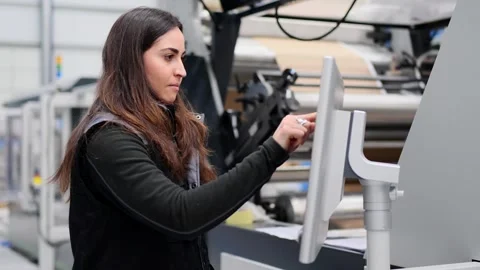 Female worker using touchscreen in a machine Stock Footage 260577275