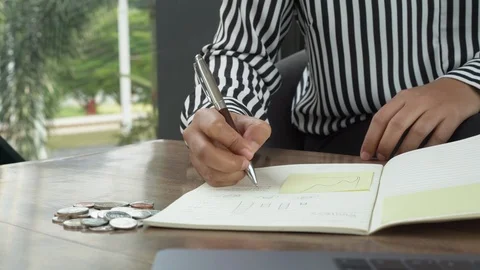 Female worker writing notes down inside her diary in a corporate business office Stock Footage 110269850