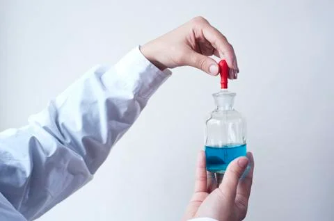Female workers doing the experiment Stock Photos