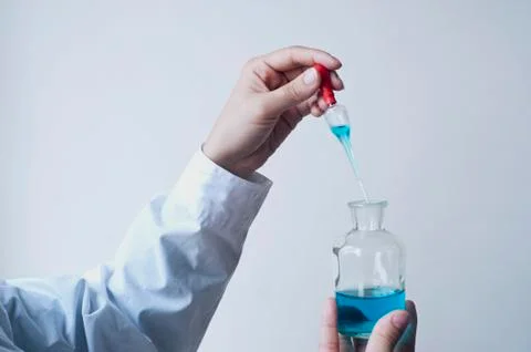 Female workers doing the experiment Stock Photos