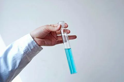 Female workers doing the experiment Stock Photos