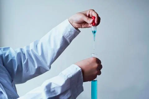 Female workers doing the experiment Stock Photos