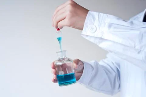 Female workers doing the experiment Stock Photos
