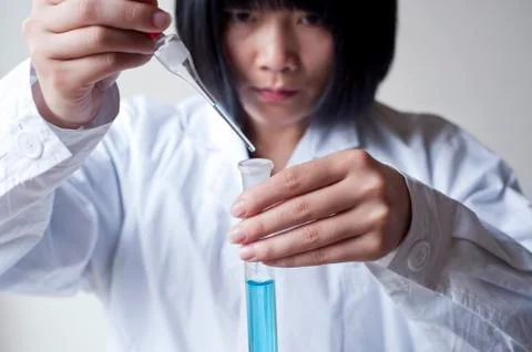 Female workers doing the experiment Foto stock