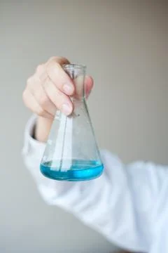 Female workers doing the experiment Stock Photos