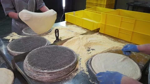 Female Workers Quickly making a Dough for Pizza on a industrial Bakery Plant. Stock Footage 166317373