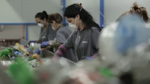 Female workers sorting plastics for recycling Stock Footage 72857109