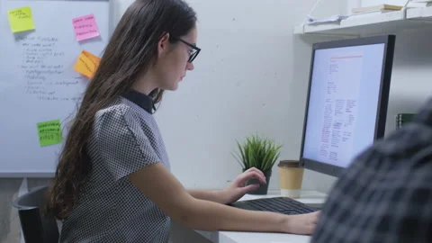 Female working with computer and looking for potential future investments Stock Footage 142299937