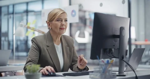 Female Working on Computer in Office Stock Footage 318065355