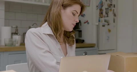 Female Working at Home Preparing Parcels for Shipping Video stock 246769251